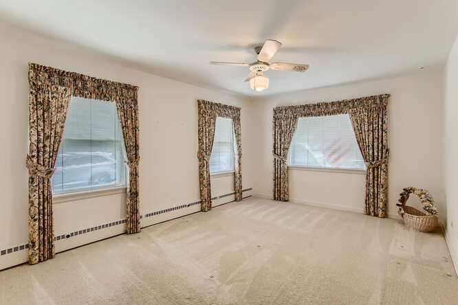 352 South Commonwealth Avenue Elgin, IL 60123 - Photo 13 of 29 an empty room with windows and fan