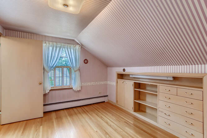 352 South Commonwealth Avenue Elgin, IL 60123 - Photo 17 of 29 an empty room with wooden floor closet and windows