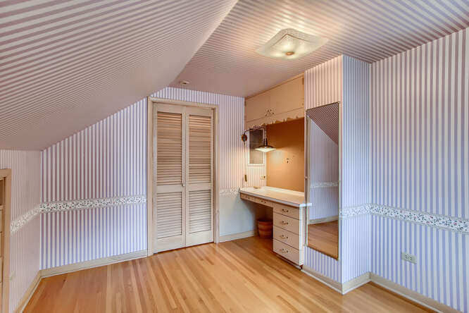 352 South Commonwealth Avenue Elgin, IL 60123 - Photo 18 of 29 an empty room with wooden floor cabinet and windows