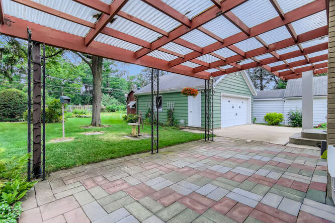 352 South Commonwealth Avenue Elgin, IL 60123 - Photo 28 of 29 a view of a backyard with plants and a patio