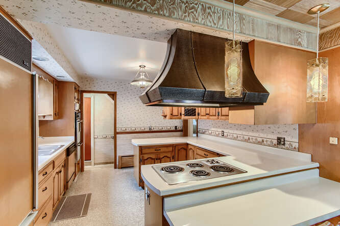 352 South Commonwealth Avenue Elgin, IL 60123 - Photo 8 of 29 a kitchen with a stove and a refrigerator