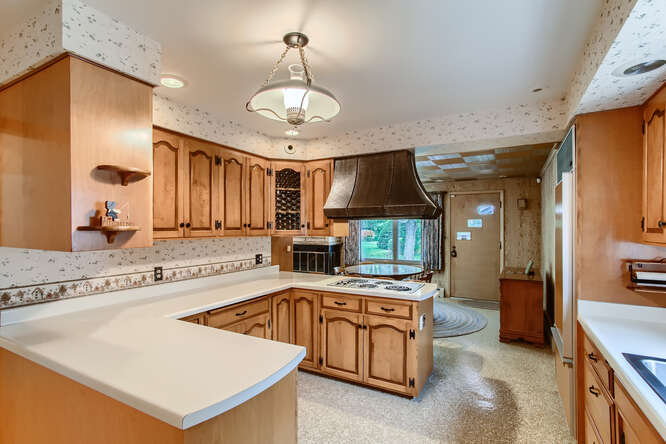 352 South Commonwealth Avenue Elgin, IL 60123 - Photo 9 of 29 a view of a kitchen sink microwave and stove