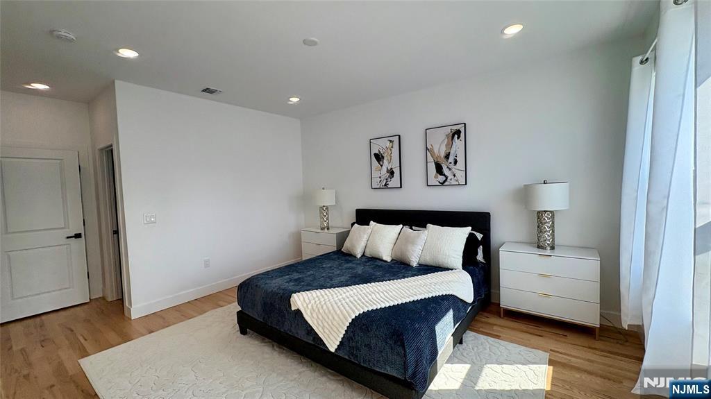 367 Devon Street, Unit 2 Kearny, NJ 07032 - Photo 14 of 30 a bedroom with a large bed and a couch