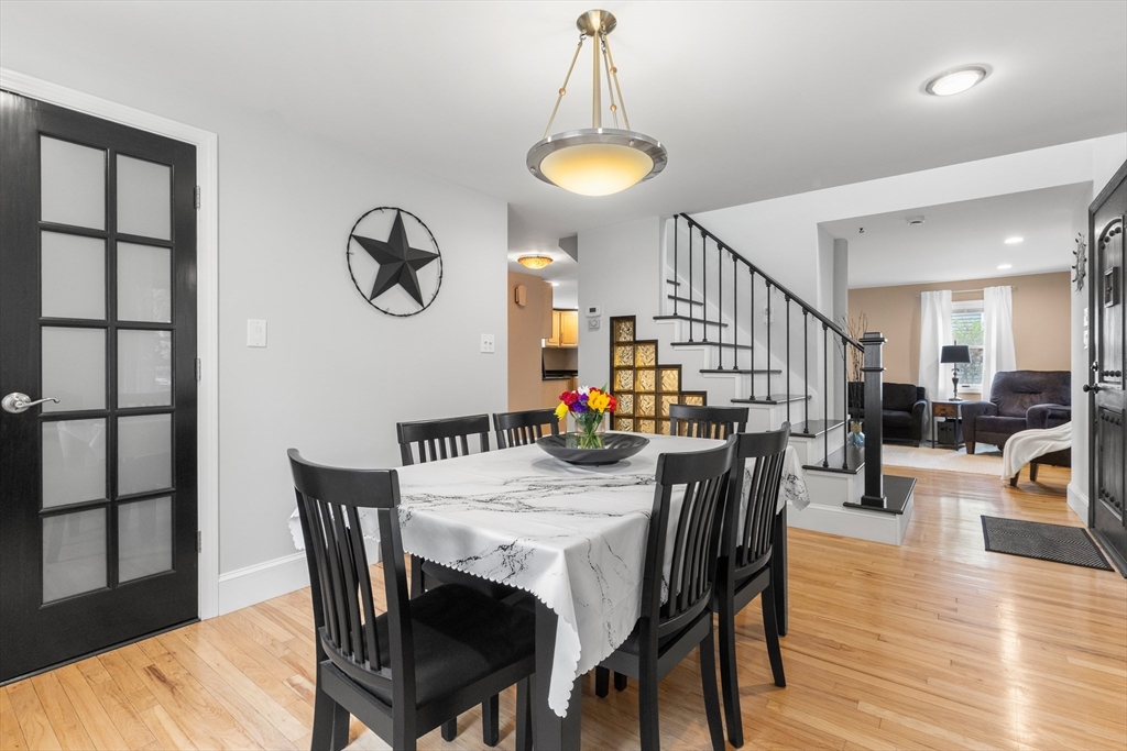 21 Leggs Hill Road Marblehead, MA 01945 - Photo 12 of 38 a view of a dining room with furniture and a chandelier
