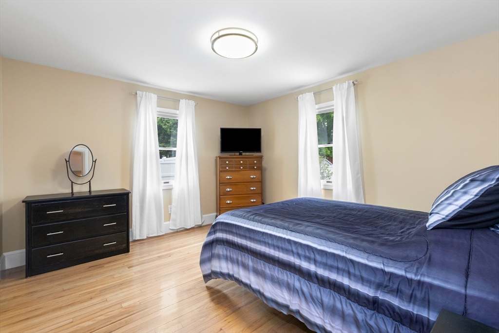 21 Leggs Hill Road Marblehead, MA 01945 - Photo 14 of 38 a bedroom with a bed and a tv