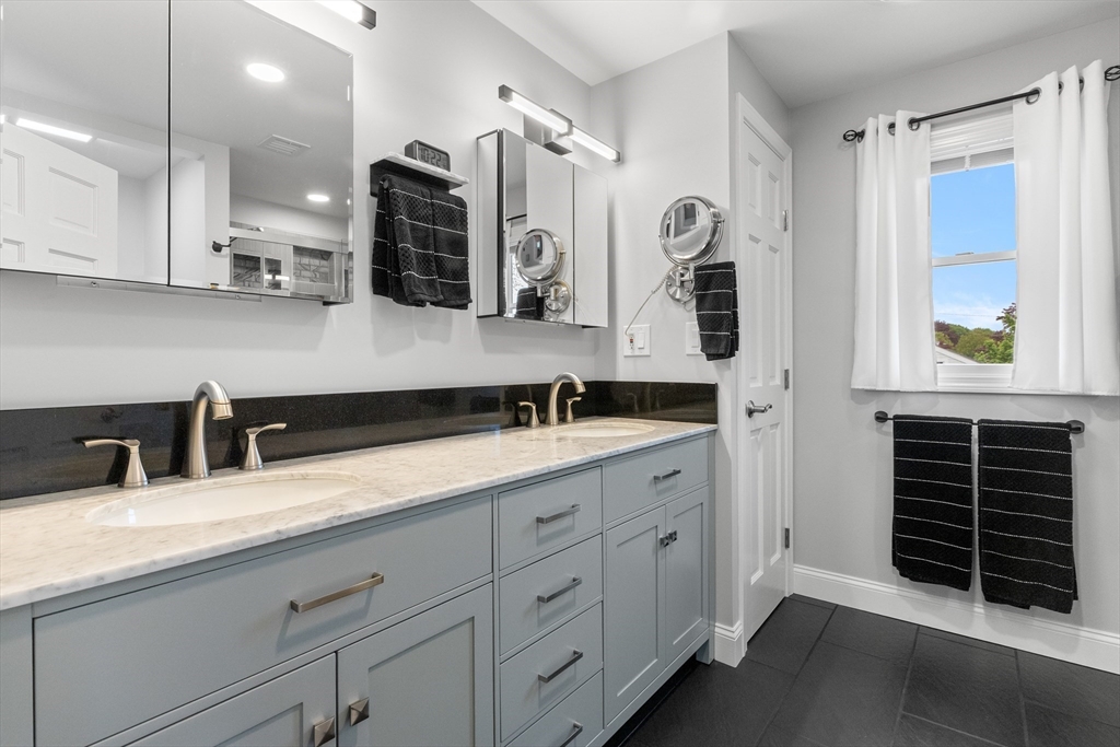 21 Leggs Hill Road Marblehead, MA 01945 - Photo 18 of 38 a bathroom with a double vanity sink and a mirror