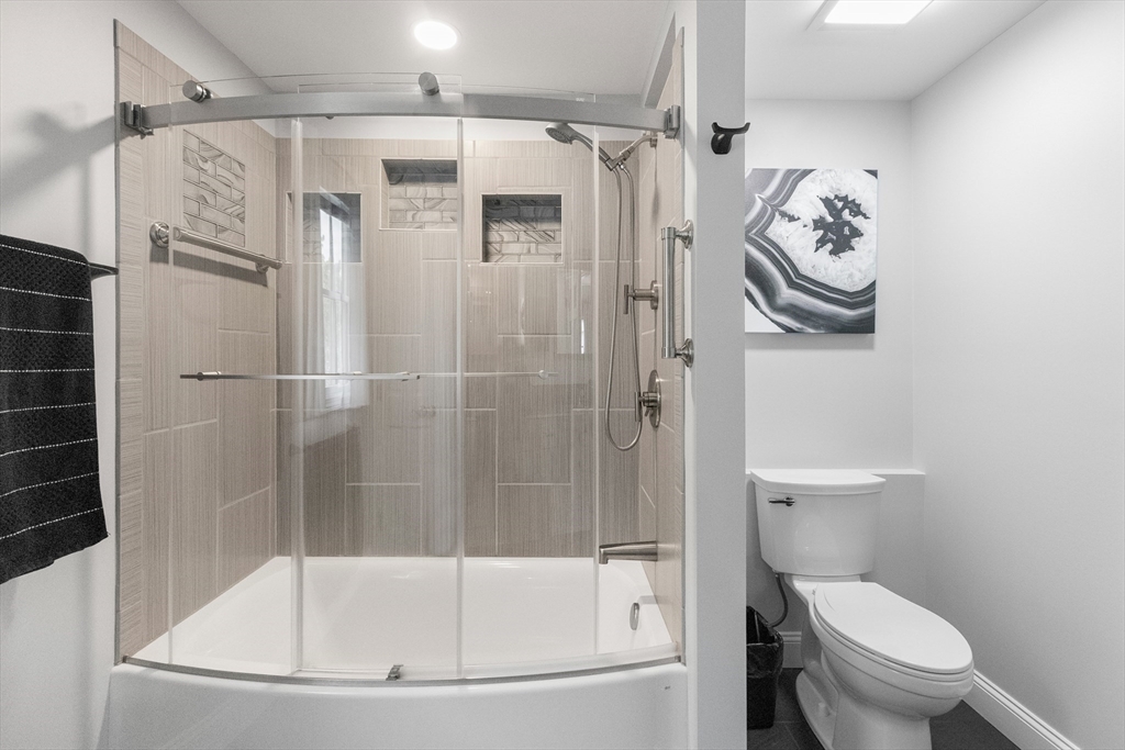 21 Leggs Hill Road Marblehead, MA 01945 - Photo 19 of 38 a bathroom with a shower a toilet and a shower