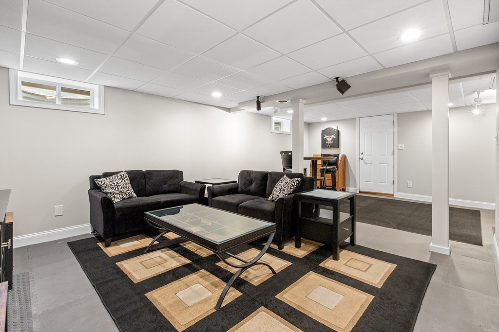21 Leggs Hill Road Marblehead, MA 01945 - Photo 22 of 38 a living room with furniture and a rug