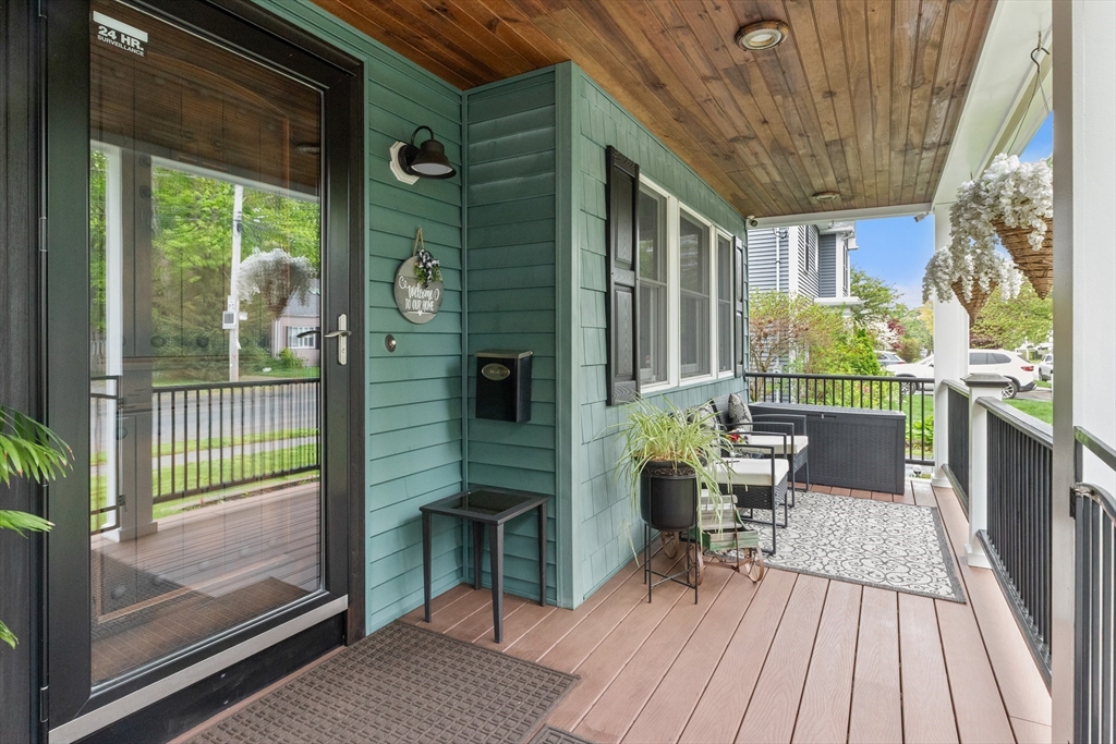 21 Leggs Hill Road Marblehead, MA 01945 - Photo 3 of 38 a balcony with wooden floor table and chairs