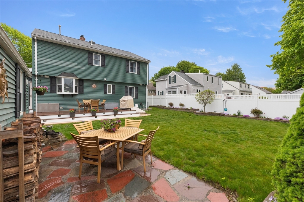 21 Leggs Hill Road Marblehead, MA 01945 - Photo 35 of 38 a view of a patio with table and chairs and potted plants