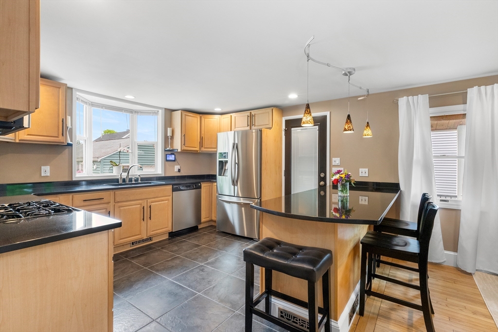 21 Leggs Hill Road Marblehead, MA 01945 - Photo 7 of 38 a kitchen with stainless steel appliances granite countertop a stove a sink dishwasher and a refrigerator