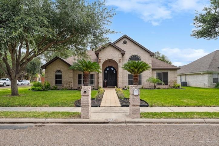 2005 East 28th Street Mission, TX 78574 - Photo 1 of 28 a front view of a house with garden