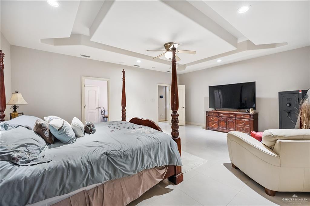 2005 East 28th Street Mission, TX 78574 - Photo 13 of 28 a bedroom with two beds and a flat screen tv