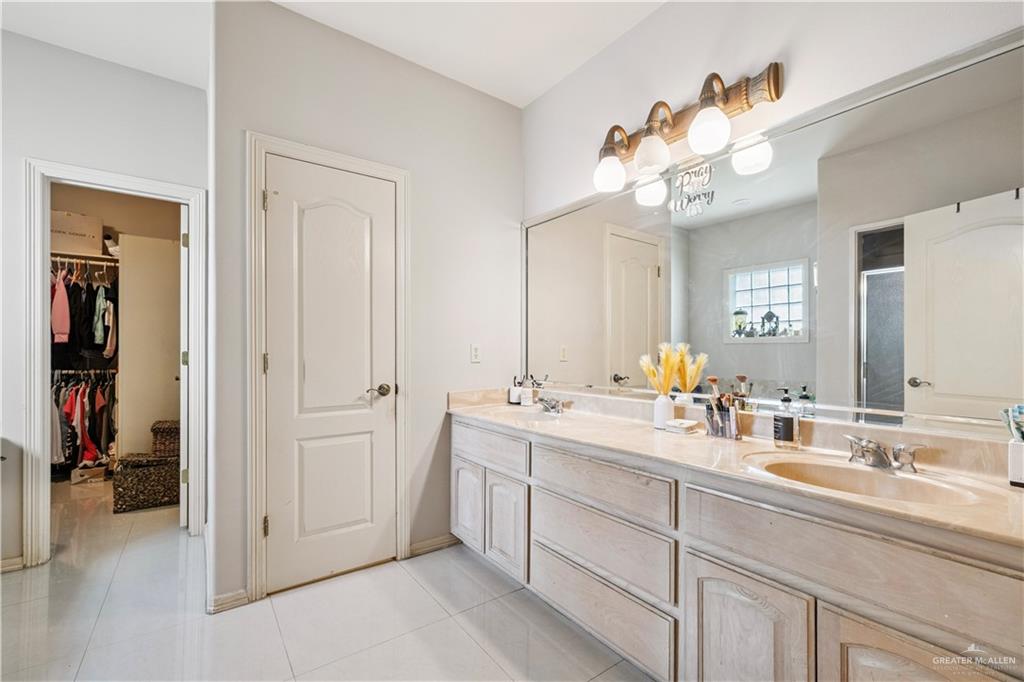 2005 East 28th Street Mission, TX 78574 - Photo 14 of 28 a bathroom with a sink vanity and a mirror