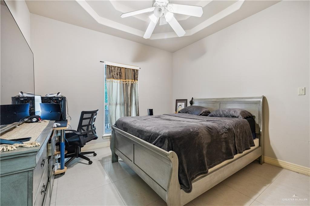 2005 East 28th Street Mission, TX 78574 - Photo 18 of 28 a bed sitting in a room next to a window