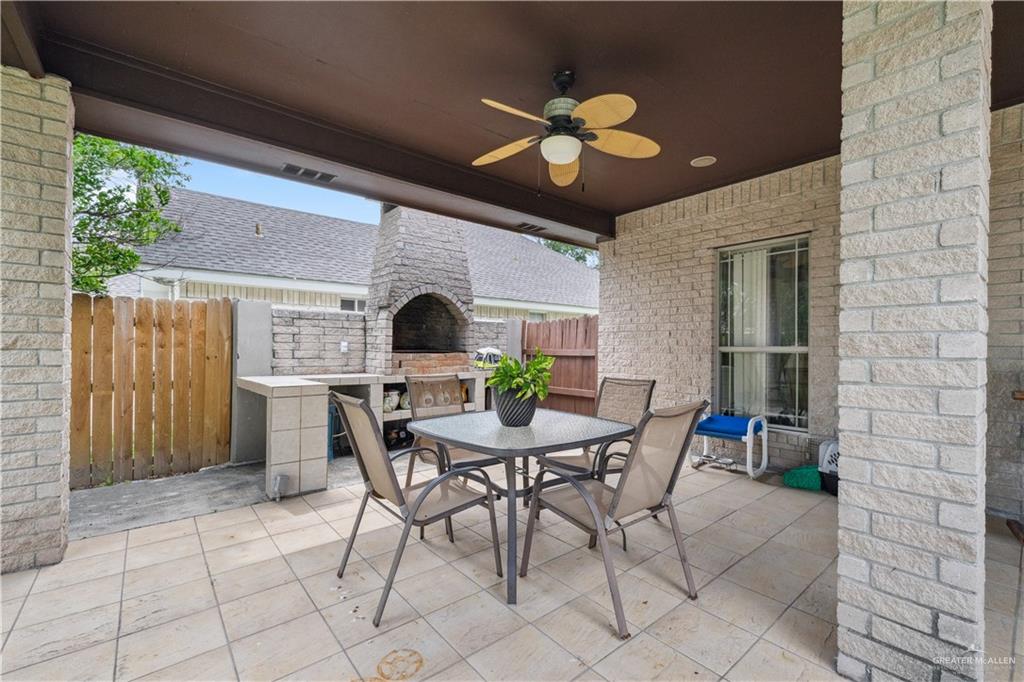 2005 East 28th Street Mission, TX 78574 - Photo 22 of 28 a view of a dining room with furniture and chandelier