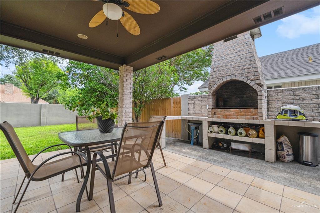 2005 East 28th Street Mission, TX 78574 - Photo 23 of 28 a view of a patio with furniture and a fireplace
