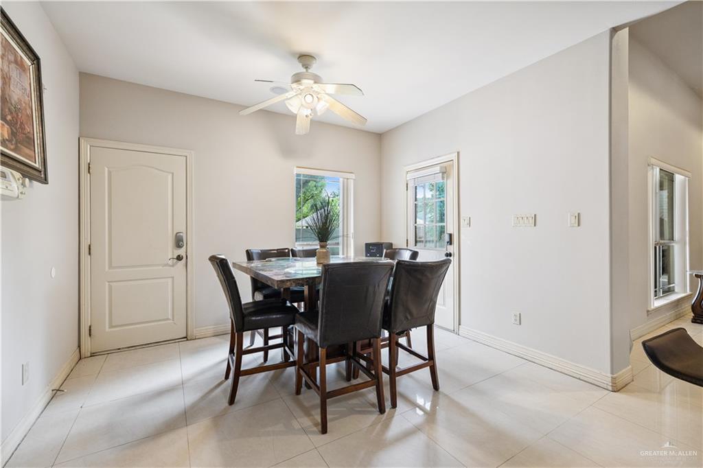 2005 East 28th Street Mission, TX 78574 - Photo 10 of 28 a view of a dining room with furniture and chandelier