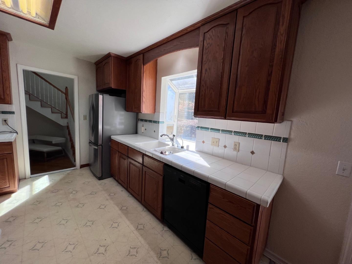 14004 Clayton Road San Jose, CA 95127 - Photo 11 of 43 a kitchen with a sink cabinets and appliances
