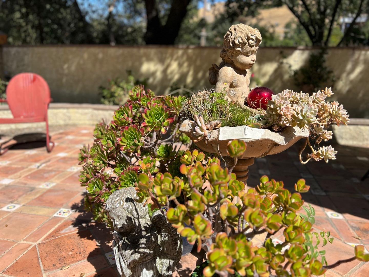 14004 Clayton Road San Jose, CA 95127 - Photo 15 of 43 a view of a fireplace with a flower plant