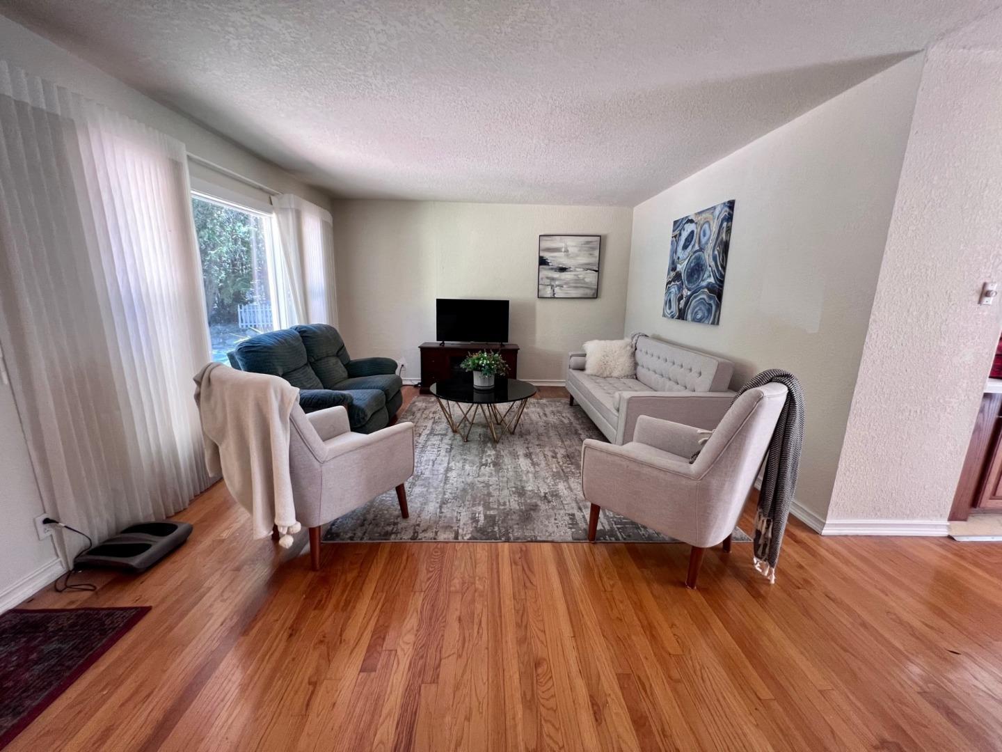 14004 Clayton Road San Jose, CA 95127 - Photo 19 of 43 a living room with furniture and a wooden floor