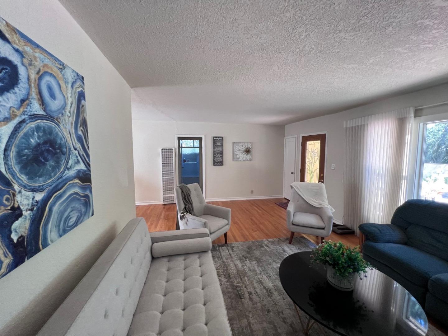 14004 Clayton Road San Jose, CA 95127 - Photo 20 of 43 a living room with furniture and wooden floor