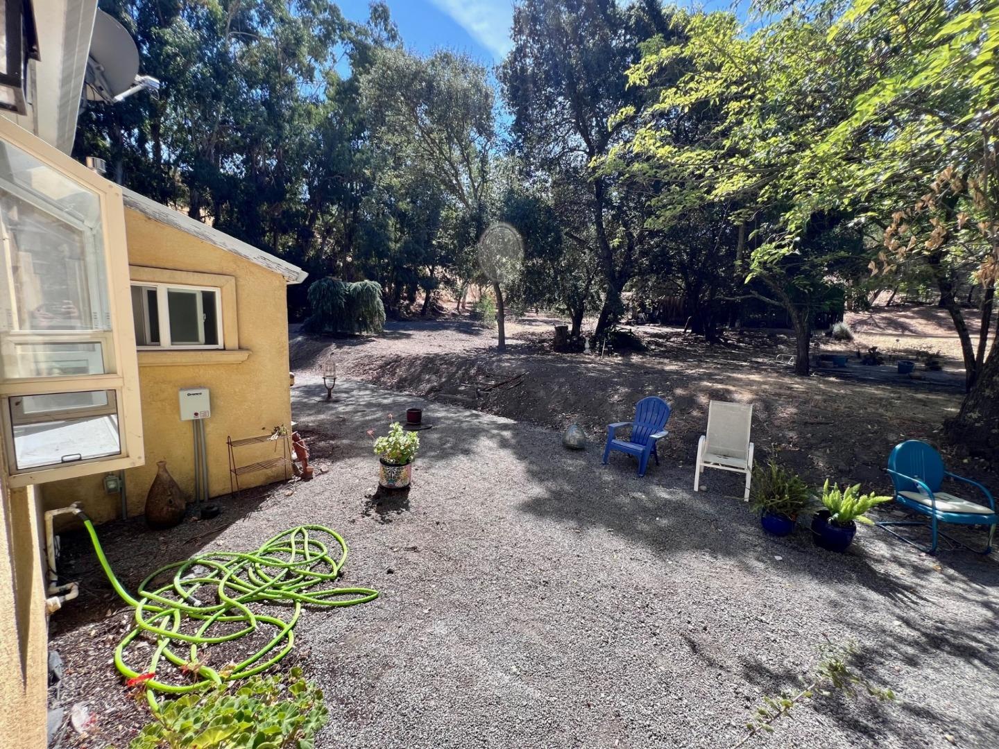 14004 Clayton Road San Jose, CA 95127 - Photo 31 of 43 a view of a backyard with chairs and a fire pit