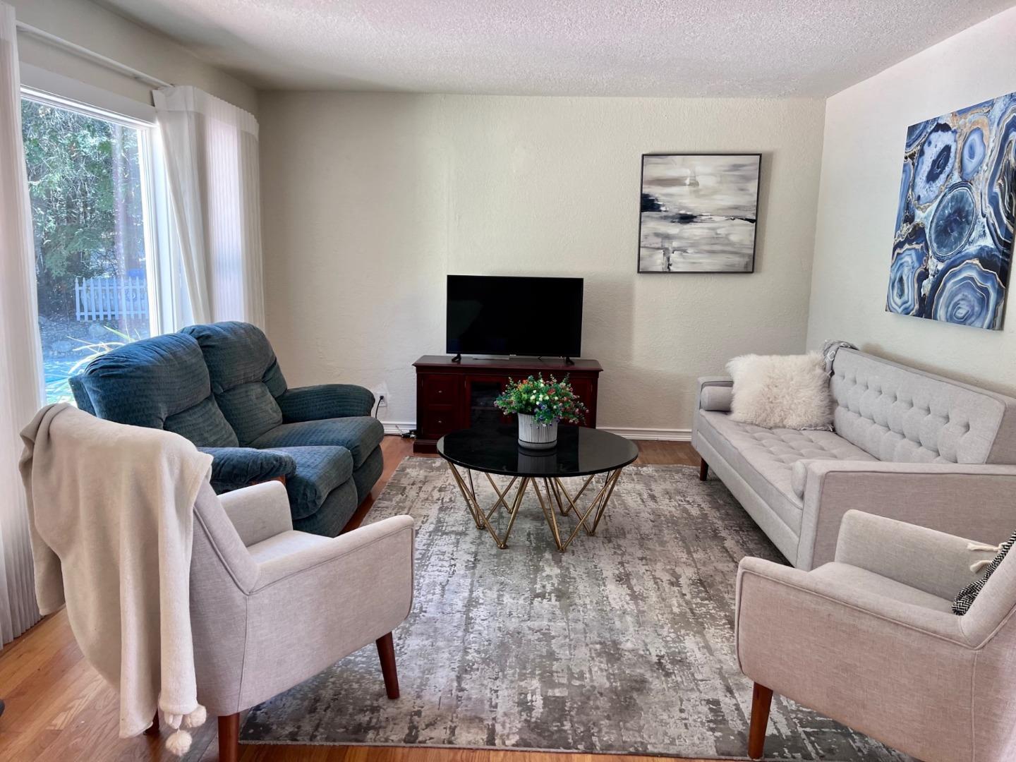 14004 Clayton Road San Jose, CA 95127 - Photo 5 of 43 a living room with furniture a couch and a flat screen tv