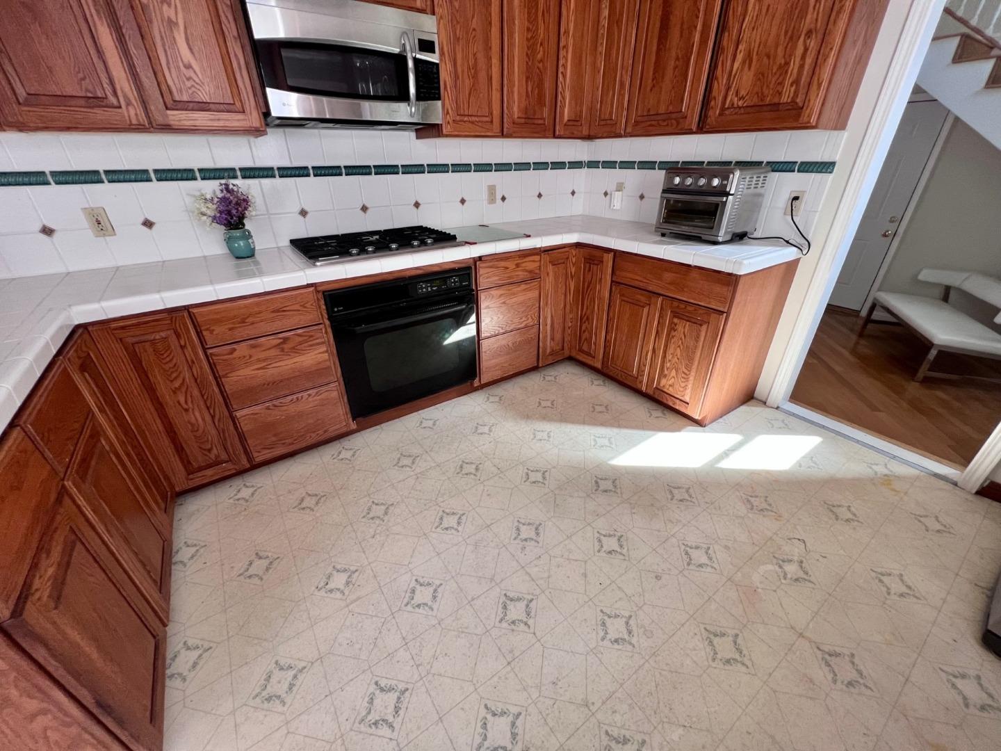14004 Clayton Road San Jose, CA 95127 - Photo 10 of 43 a kitchen with stainless steel appliances granite countertop a sink stove and cabinets