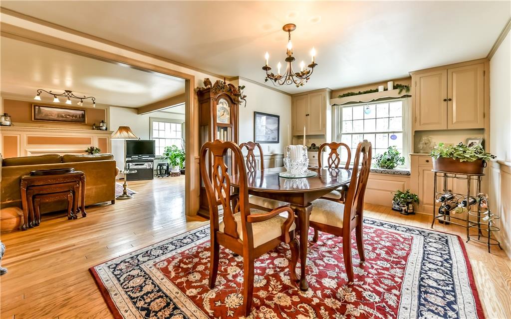 3923 Gibsonia Road Gibsonia, PA 15044 - Photo 6 of 25 Extra large dining room opens to the living room and has elegant built-in cabinets and Wainscot Panels! Great space for family dinners!