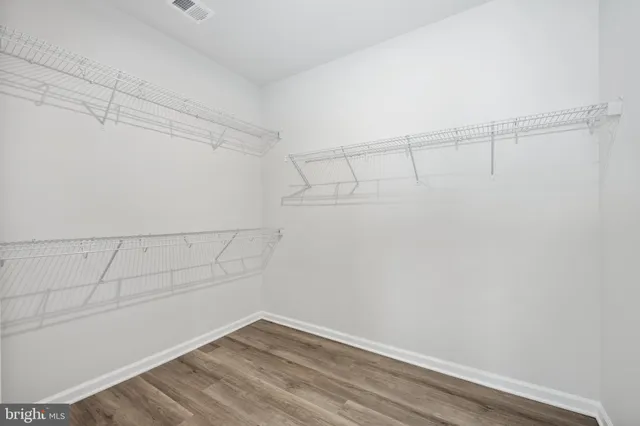 a view of a balcony with wooden floor