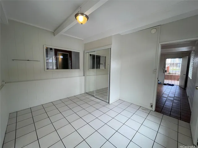 a view of an empty room and window