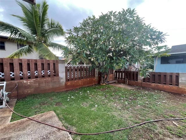 a view of a chair and table in the patio