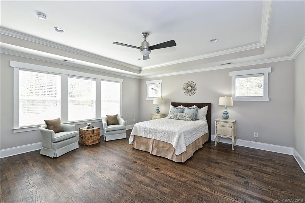 1624 Brook Road Charlotte, NC 28205 - Photo 21 of 34 a spacious bedroom with a bed and a couch