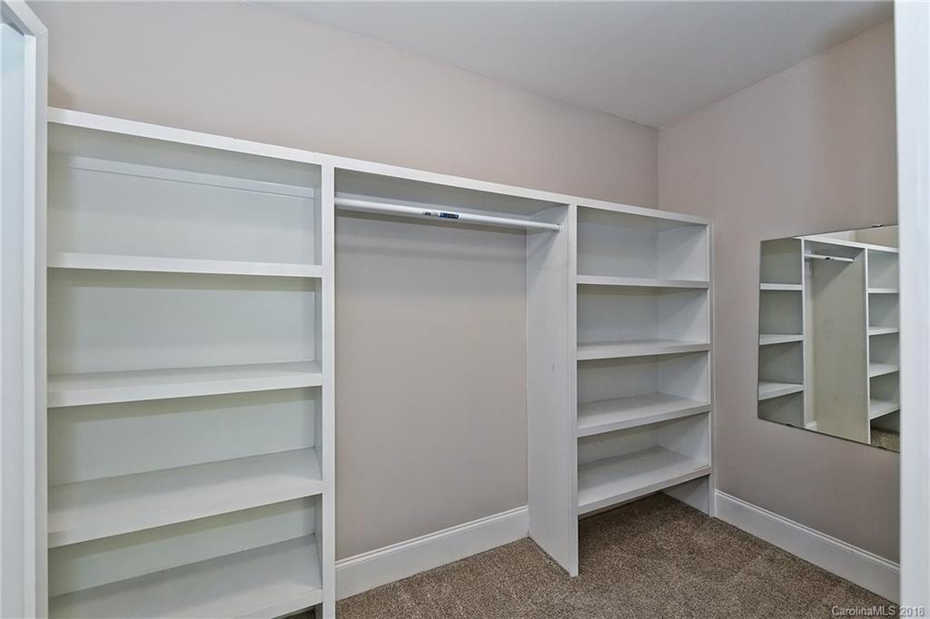 1624 Brook Road Charlotte, NC 28205 - Photo 24 of 34 a view of walk in closet with empty racks