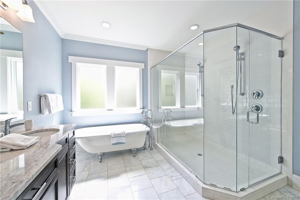 1624 Brook Road Charlotte, NC 28205 - Photo 26 of 34 a spacious bathroom with a tub shower and sink