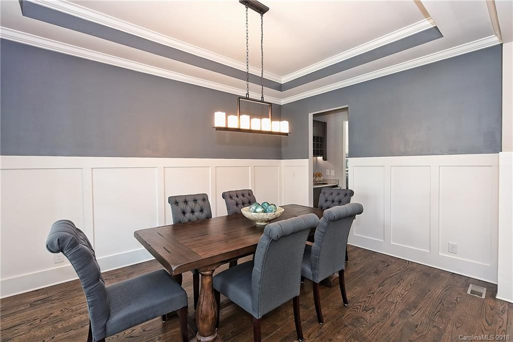 1624 Brook Road Charlotte, NC 28205 - Photo 8 of 34 a view of a dining room with furniture and chandelier
