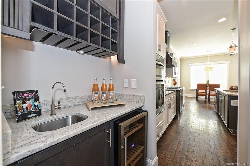 1624 Brook Road Charlotte, NC 28205 - Photo 9 of 34 a kitchen with a sink and a refrigerator