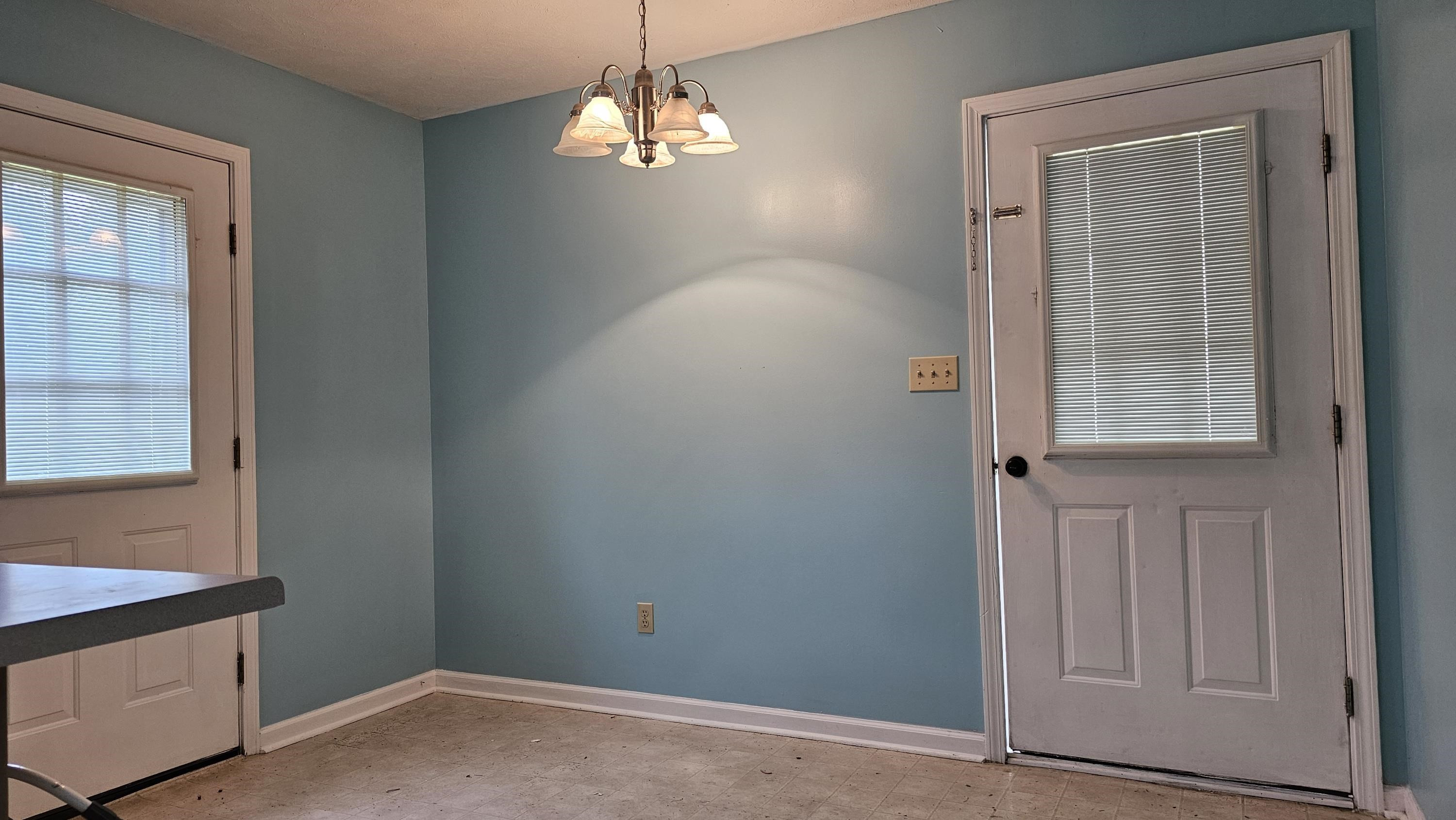 1740 Conner Whitefield Road Ripley, TN 38063 - Photo 8 of 10 wooden floor in an empty room with a window