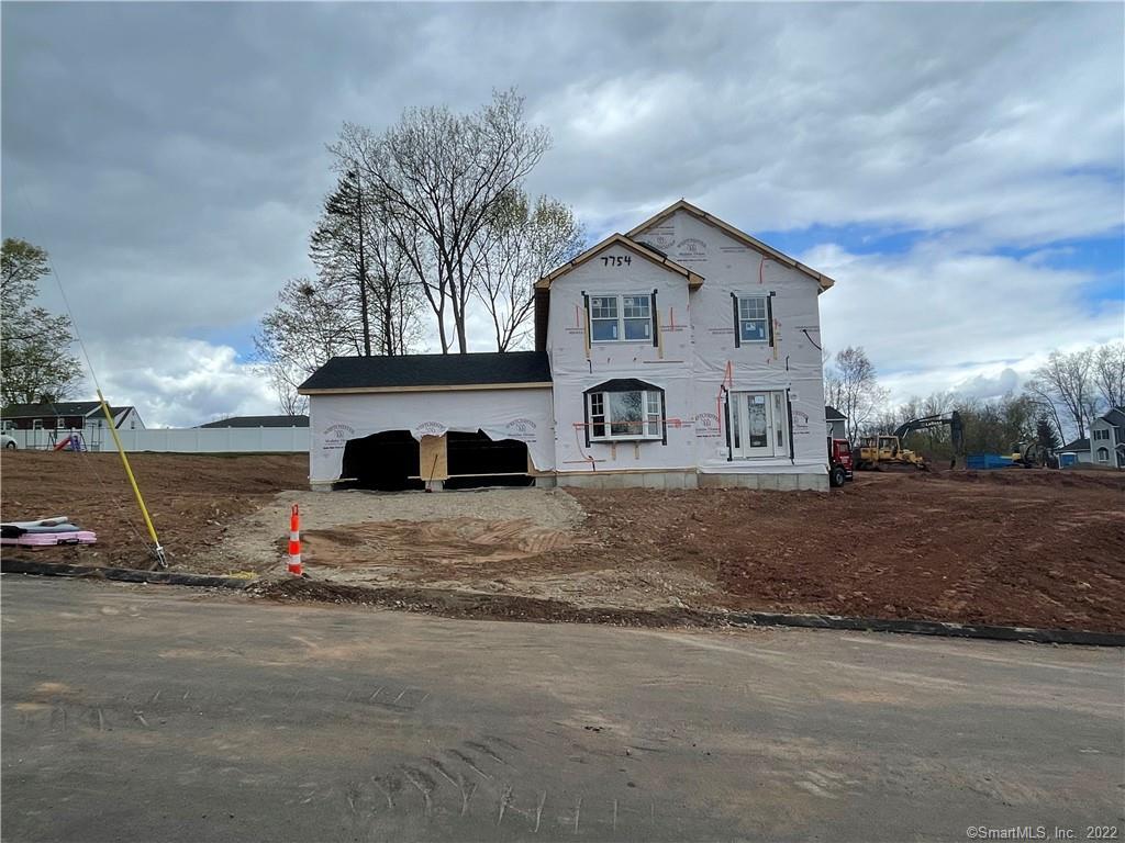 a house with sign broad in front of it