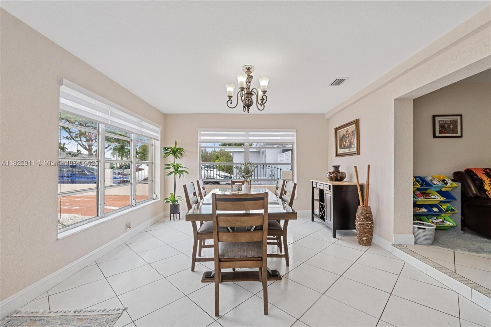 230 West 47th Street Hialeah, FL 33012 - Photo 16 of 58 a view of a dining room with furniture window and outside view