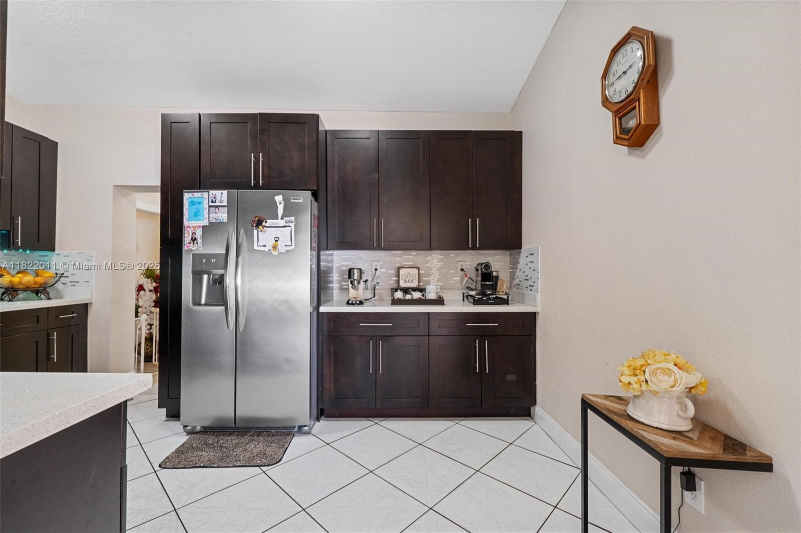 230 West 47th Street Hialeah, FL 33012 - Photo 20 of 58 a kitchen with stainless steel appliances granite countertop a refrigerator and a stove top oven