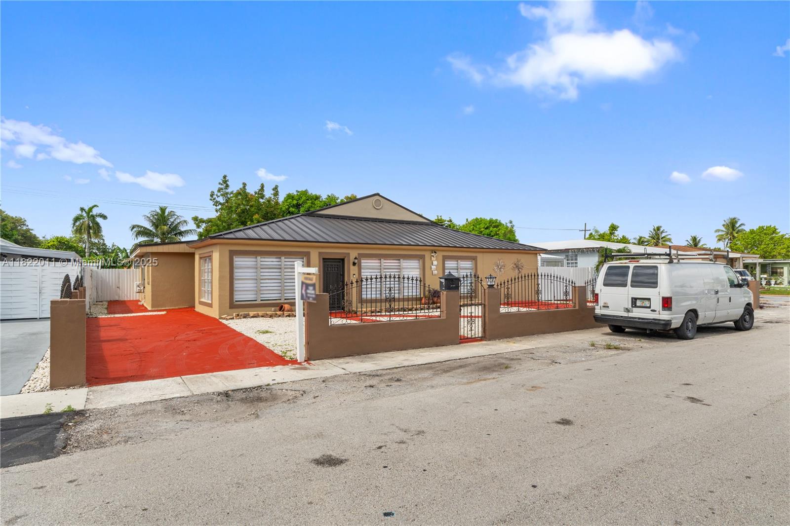 230 West 47th Street Hialeah, FL 33012 - Photo 2 of 58 a front view of a house with a yard