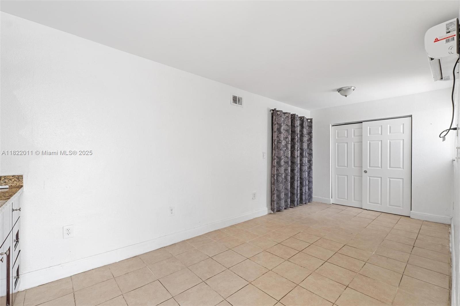 230 West 47th Street Hialeah, FL 33012 - Photo 28 of 58 a view of a room with an empty space