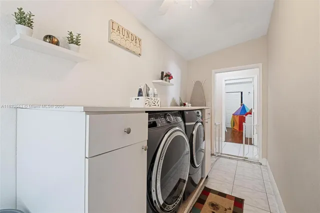 a view of a livingroom with furniture and a window