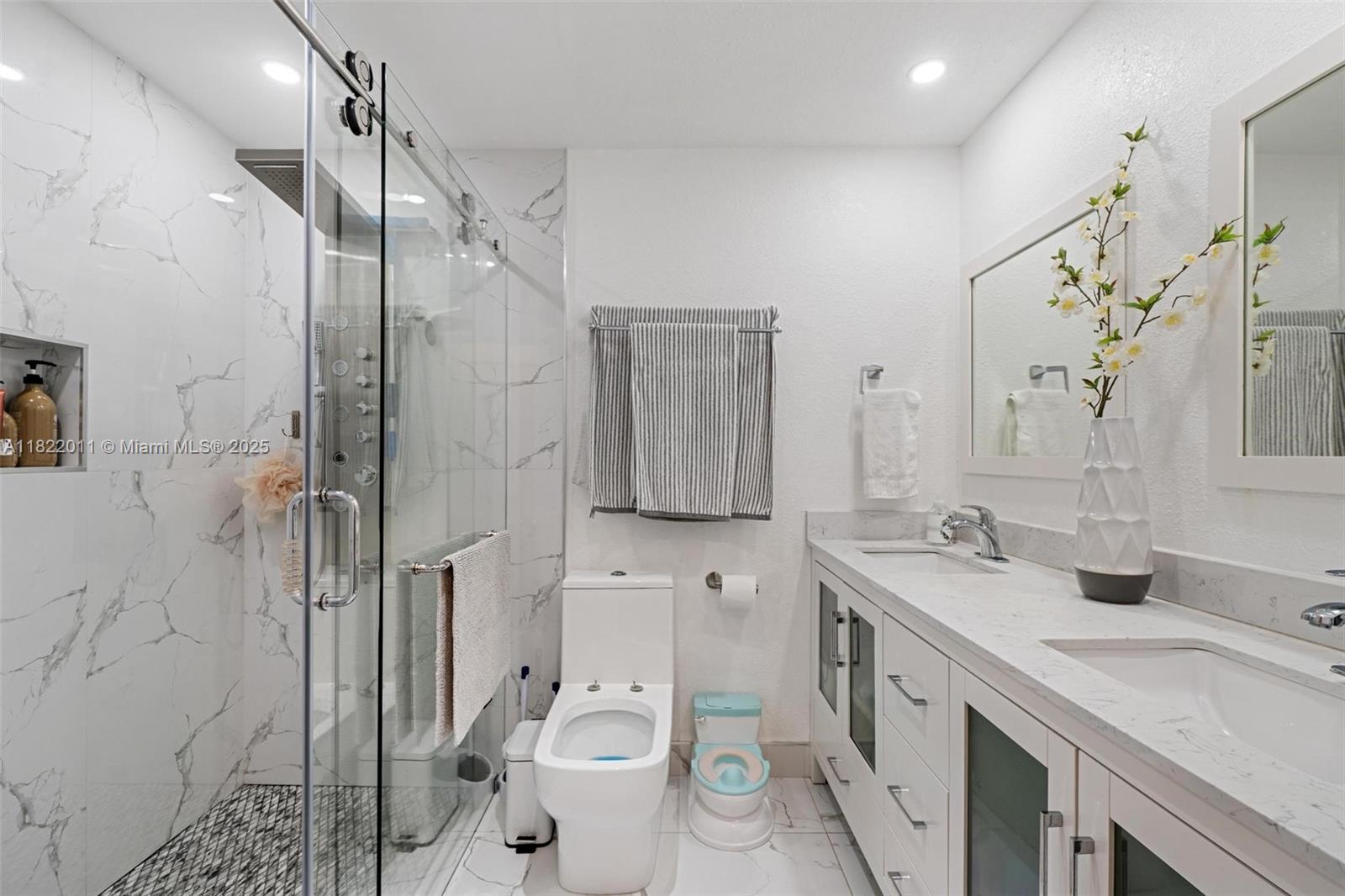 230 West 47th Street Hialeah, FL 33012 - Photo 35 of 58 a bathroom with a granite countertop sink toilet and shower