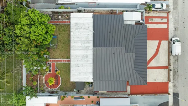 a living room with furniture a table and chair
