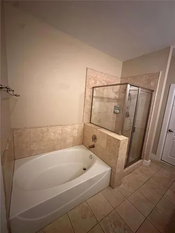 a kitchen with a sink and a stove with wooden floor