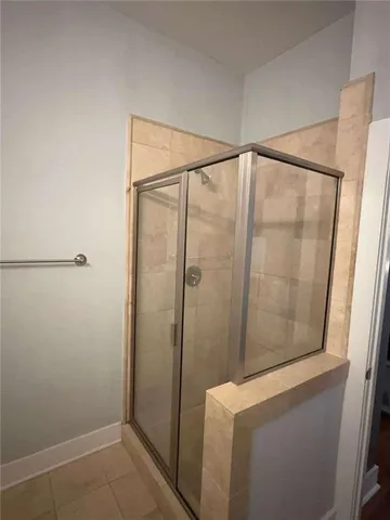 a bedroom with a bed and a ceiling fan