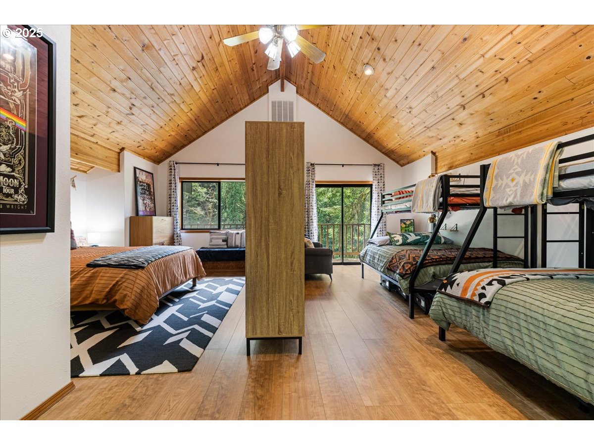 1717 Kalama River Road Kalama, WA 98625 - Photo 16 of 48 a bedroom with furniture and a wooden floor